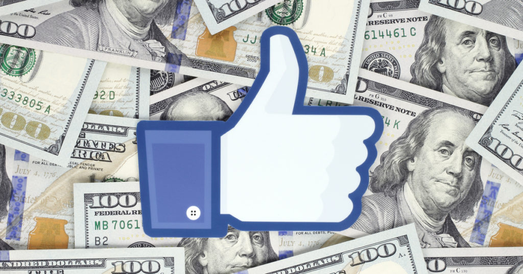 Facebook like icon on top of 100USD banknotes