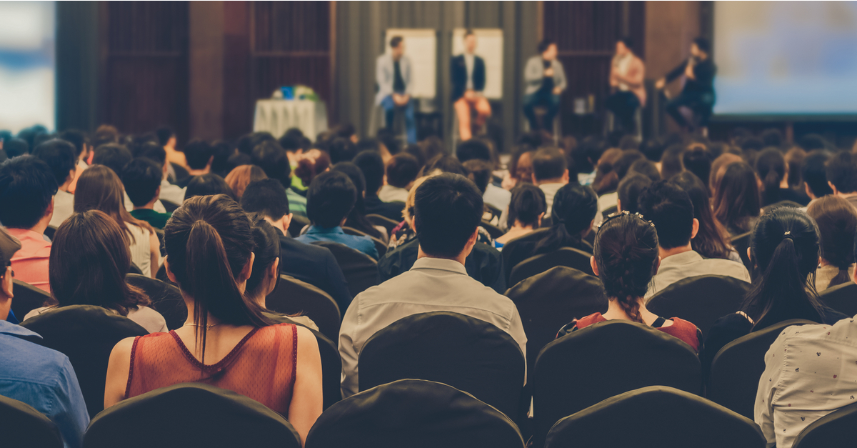 Audience watching panel discussion