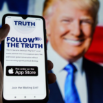 Phone with Truth Social interface on mobile against background of Donald Trump image